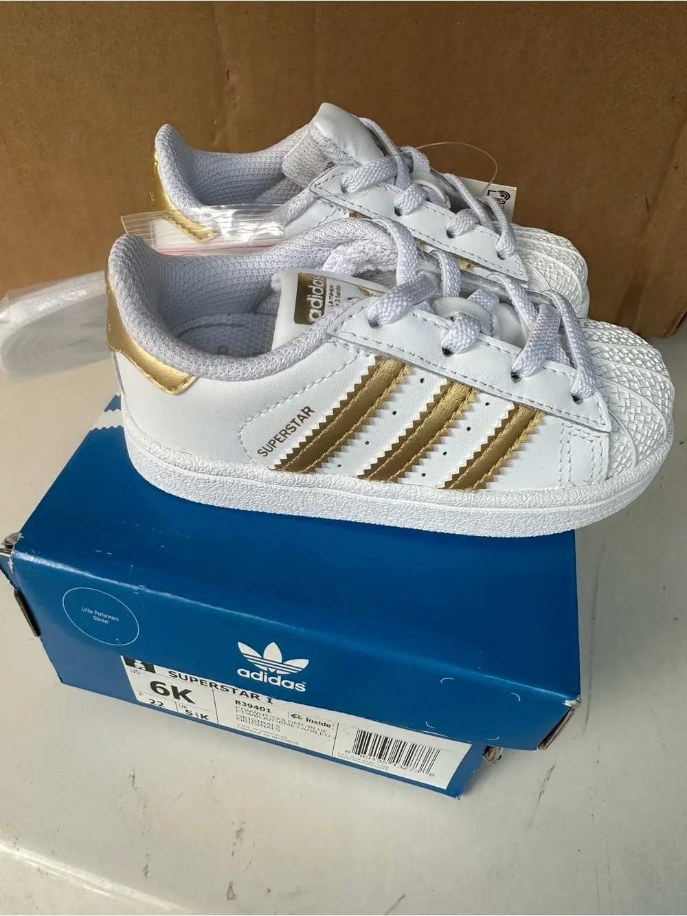 adidas Kids White Sneakers with Gold Stripes